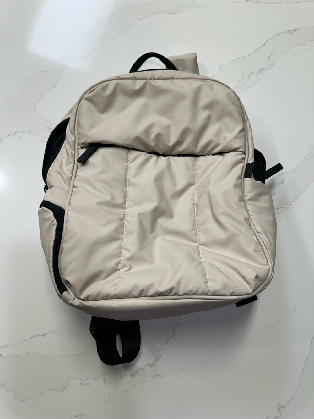 Calpak Light Beige Padded Backpack with Black Accents. Travel Backpack